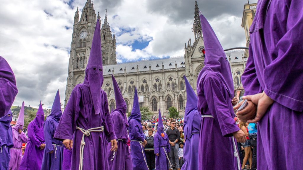 Participants wearing purple pointy hoods