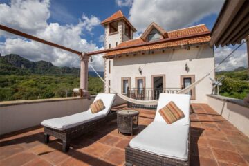 Outdoor sun loungers at Hotel Casa Isabella