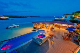 Night view of the pool at the Solymar Galapagos Hotel