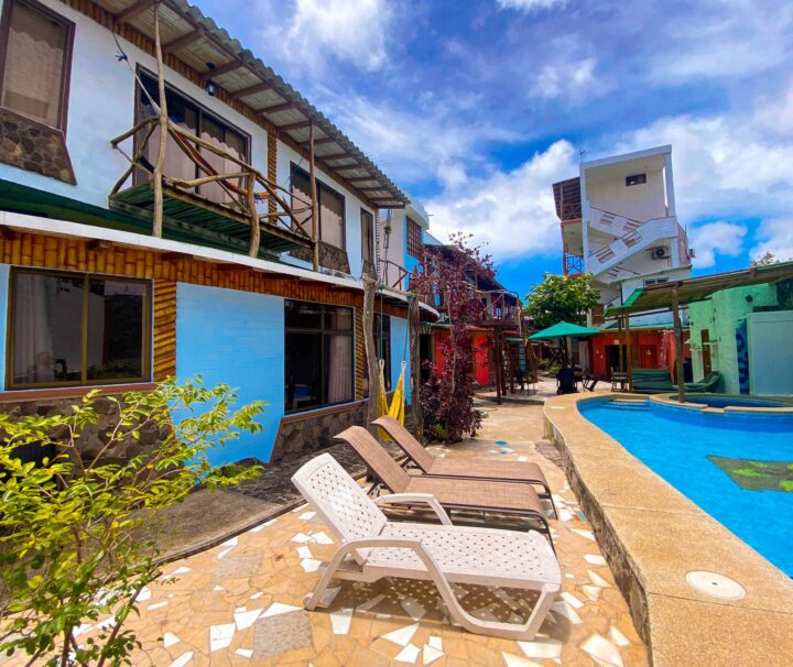 Sun loungers in front of the outdoor pool at the Hotel Miconia Galapagos