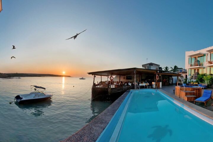 outdoor pool with ocean view at the Solymar Galapagos Hotel